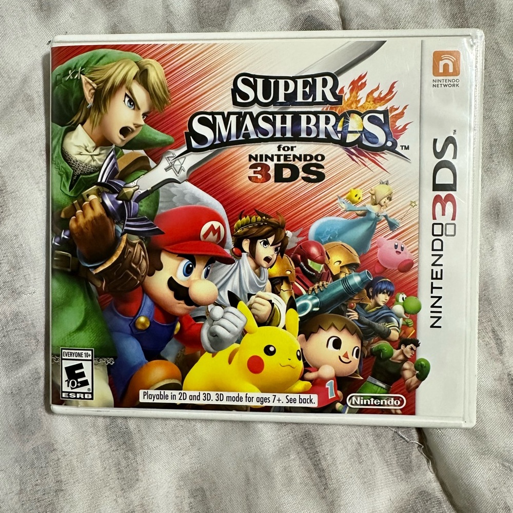Mario. Super smash brothers. Nintendo 3ds in its case